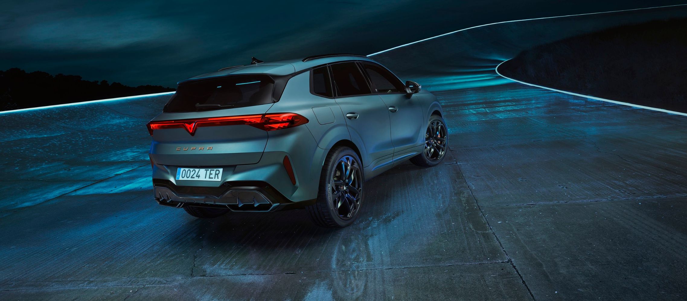 side view of a new 2024 cupra leon's red rear light, highlighting the sleek lines and lighting design against a dark background. side view of a new 2024 cupra leon's red rear light, highlighting the sleek lines and lighting design against a dark background.